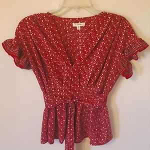 Red patterned blouse